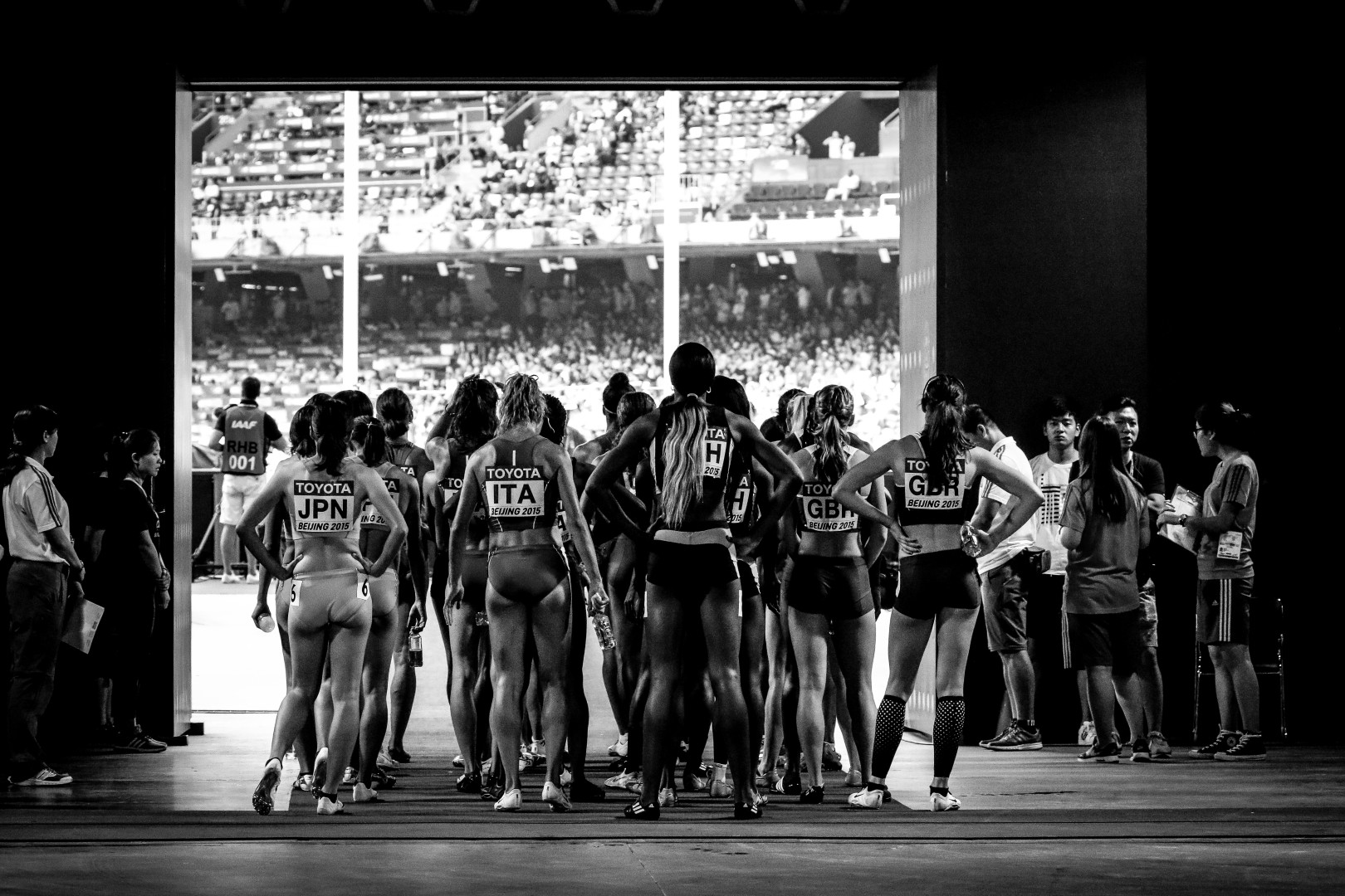 Black & White photograph of female athletes waiting behind the scenes at the 2015 World Athletics Championships.