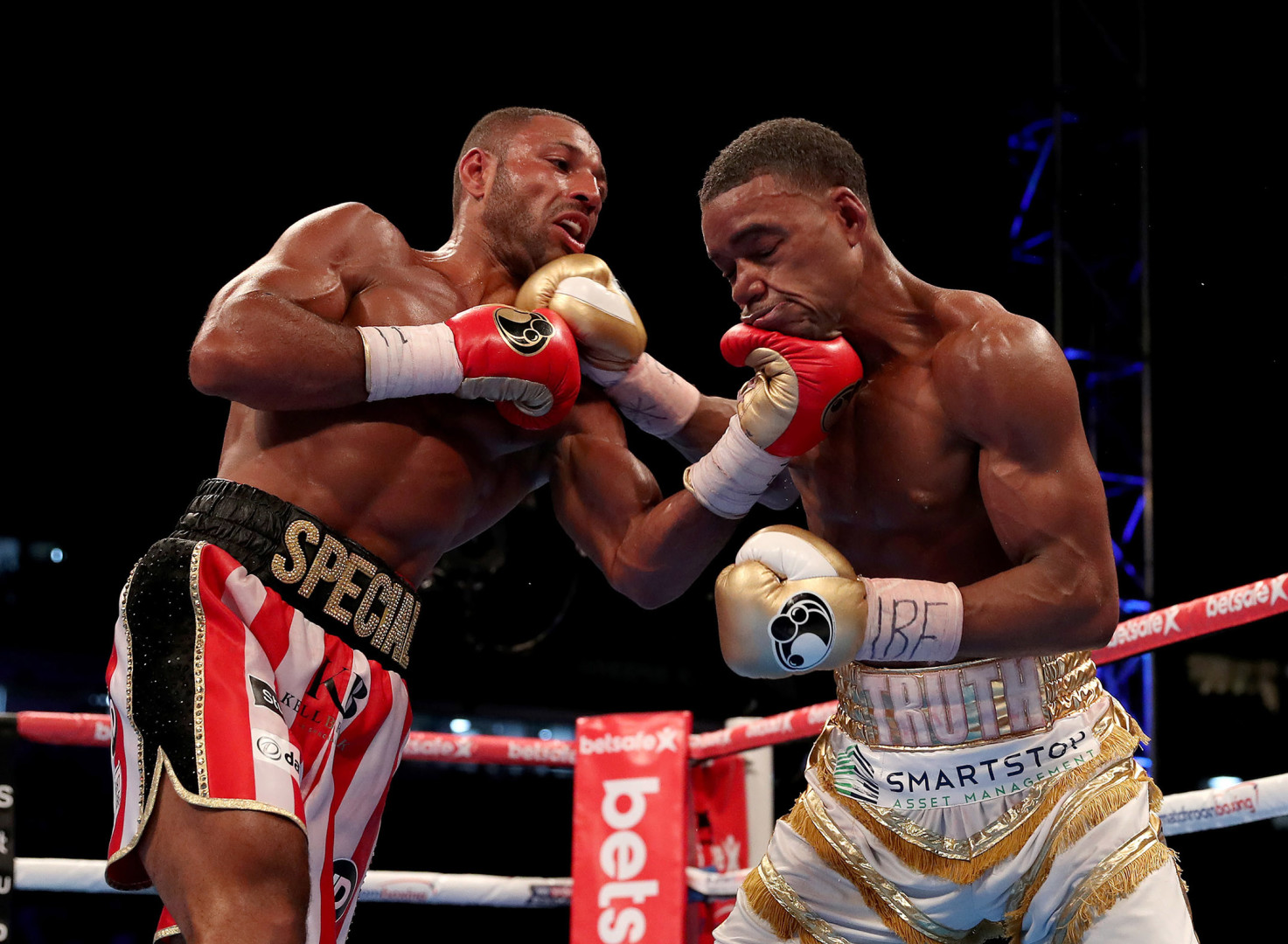 Boxer landing a hit to the chin on opposing boxer.