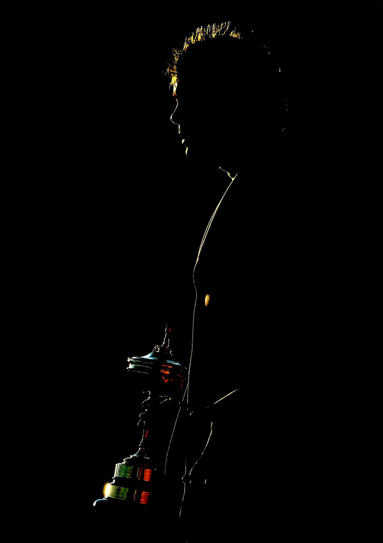 Silhouette of the Ryder Cup winner as the light hits his side.