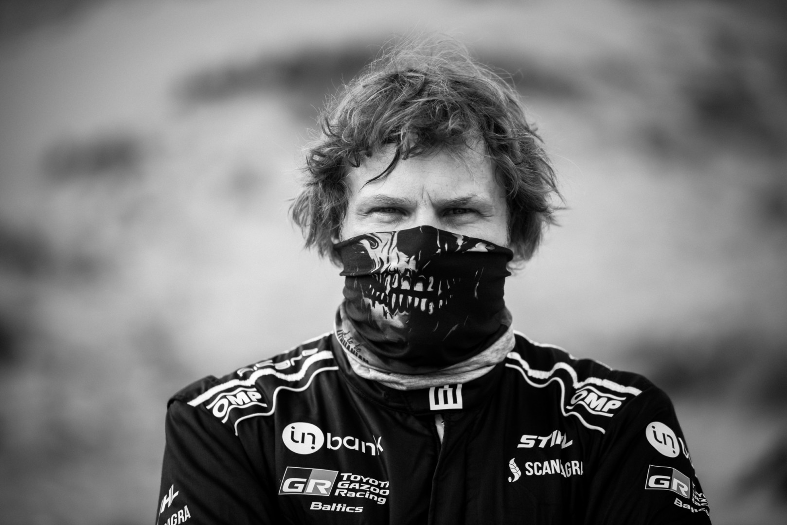 Black & White photograph of a dust mask covering a racer's face.