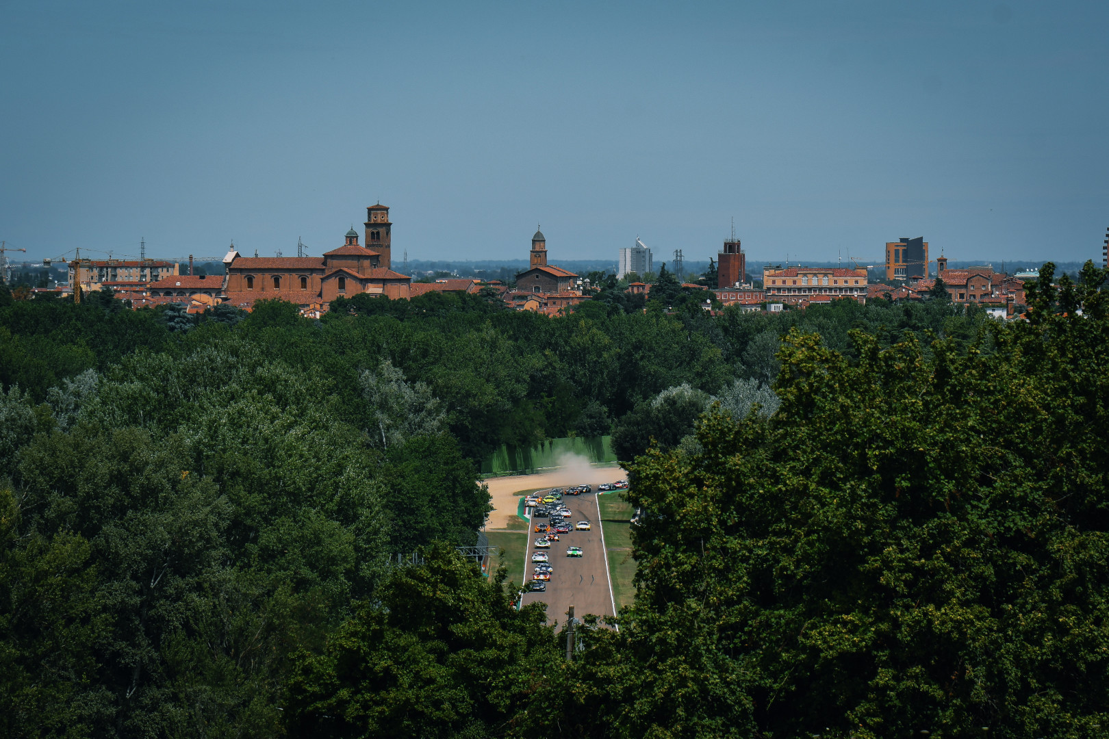 Glimpse of race track through the middle of the trees at the Imola F1