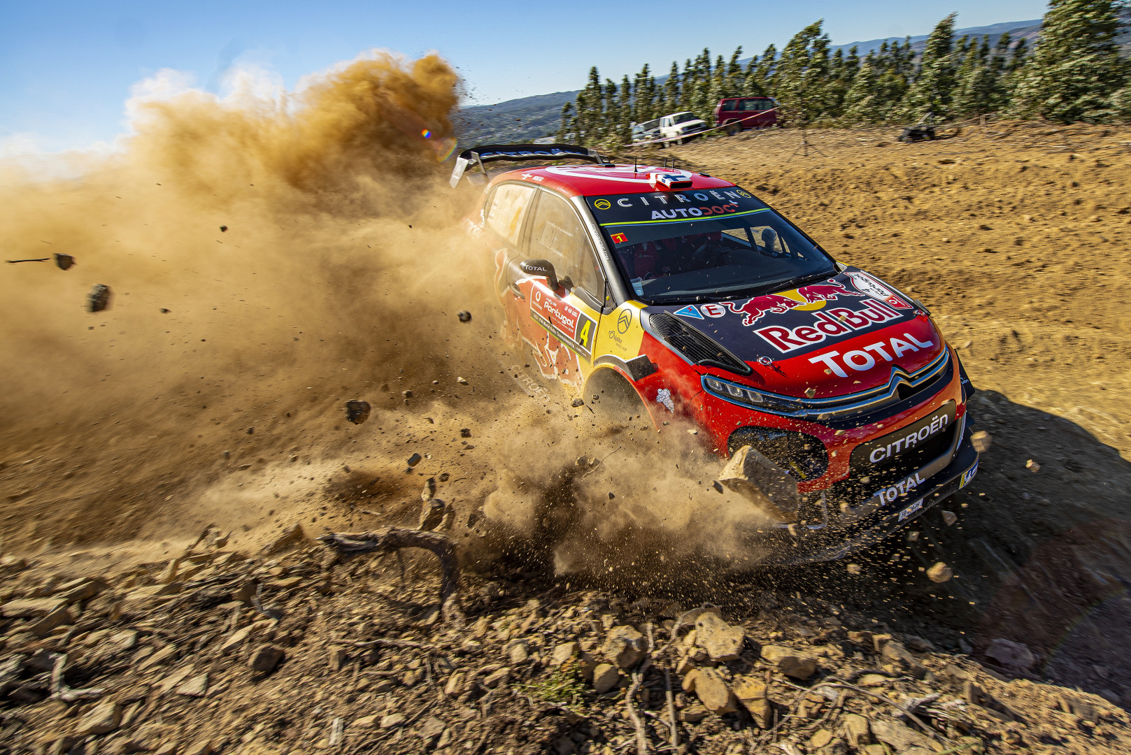 Esapekka Lappi skidding through dirt track in the World Rally Championship Portugal.