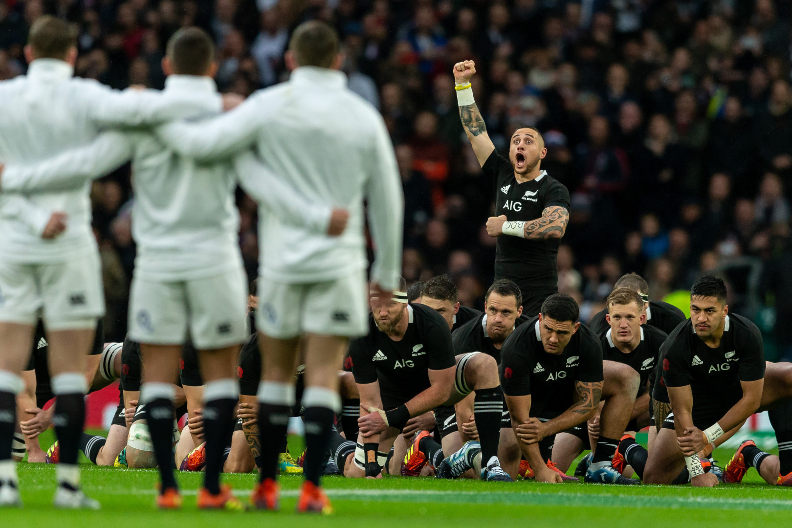 All Blacks performing the Haka as England rugby team watch on.
