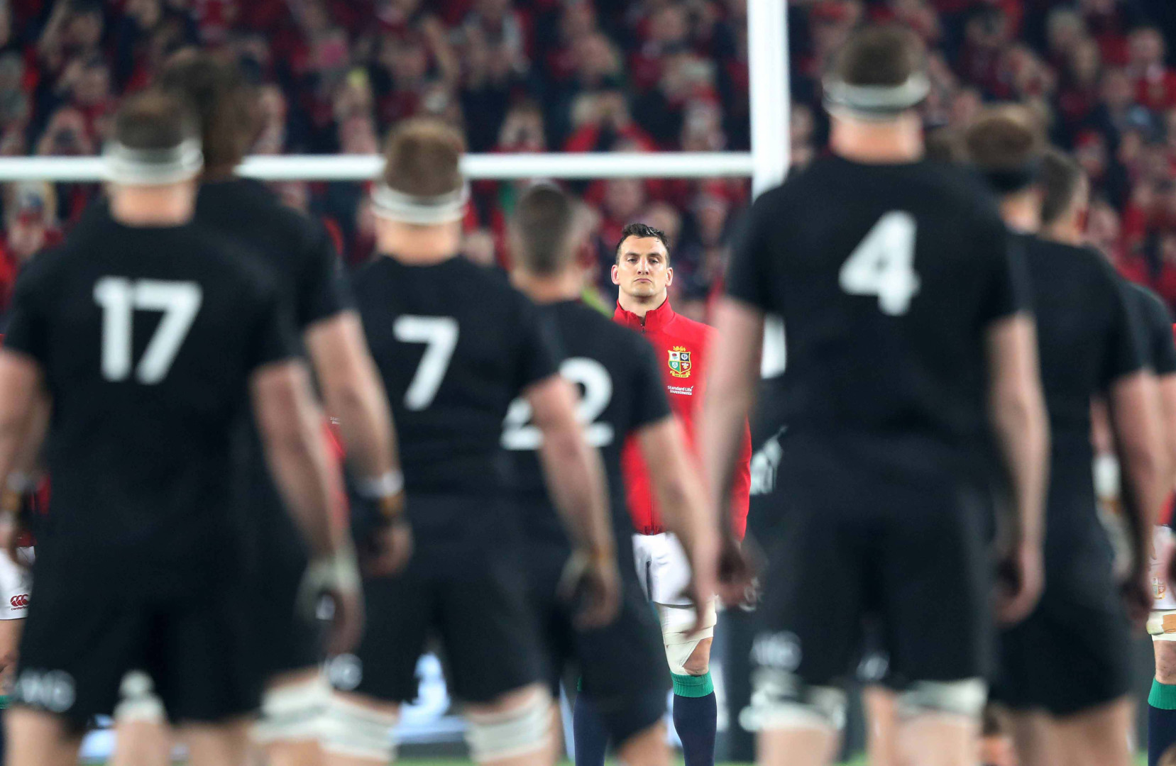 British & Irish Lions captain stares down the All Blacks as they perform the Haka.