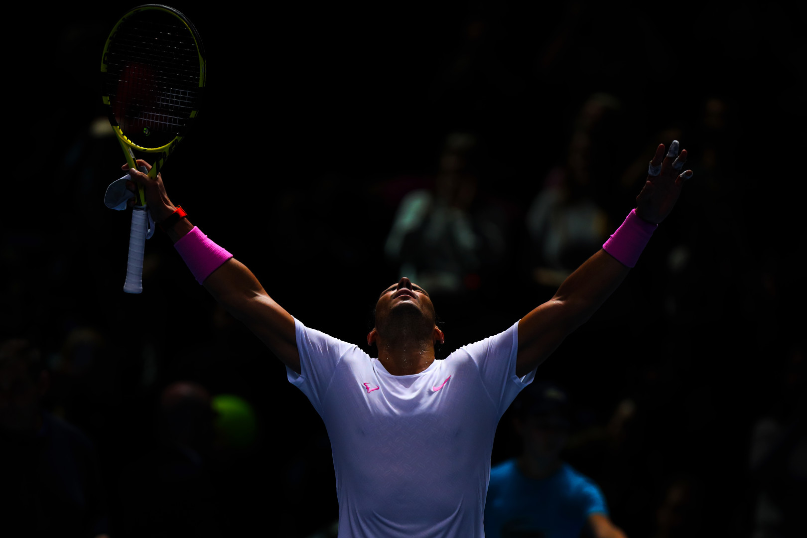 Stefanos Tsitsipas with his arms high in the air after winning the ATP Cup in 2019.