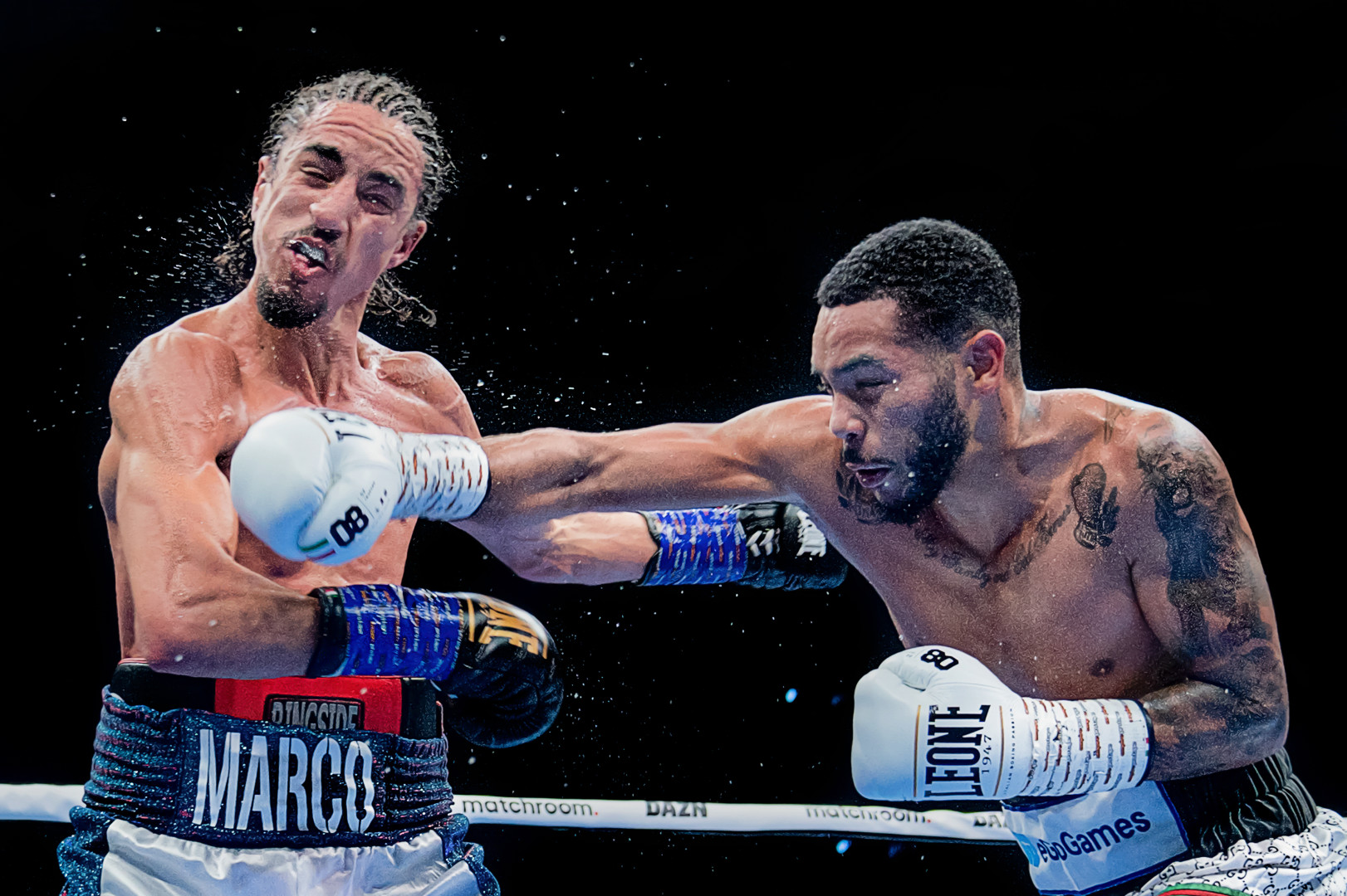 Jonathan Alonso landing an accurate blow to the face of Mohamed El Marcouchi as spit and saliva sprays from his mouth.