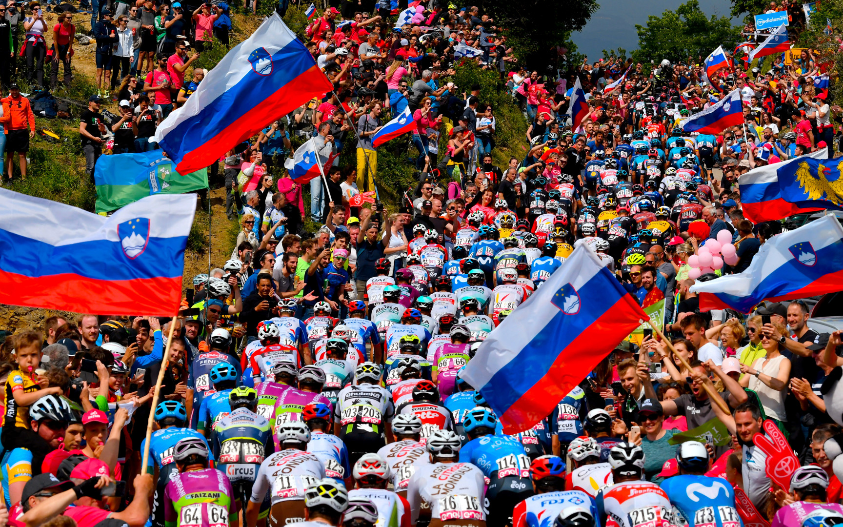 Slovenian people cheering on the passage of the Giro D'Italia 2021.