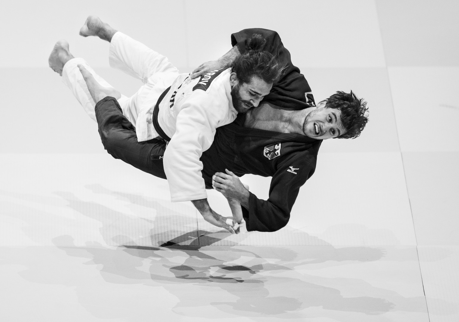 Black & White photograph of two Judo competitors wrestling mid air.