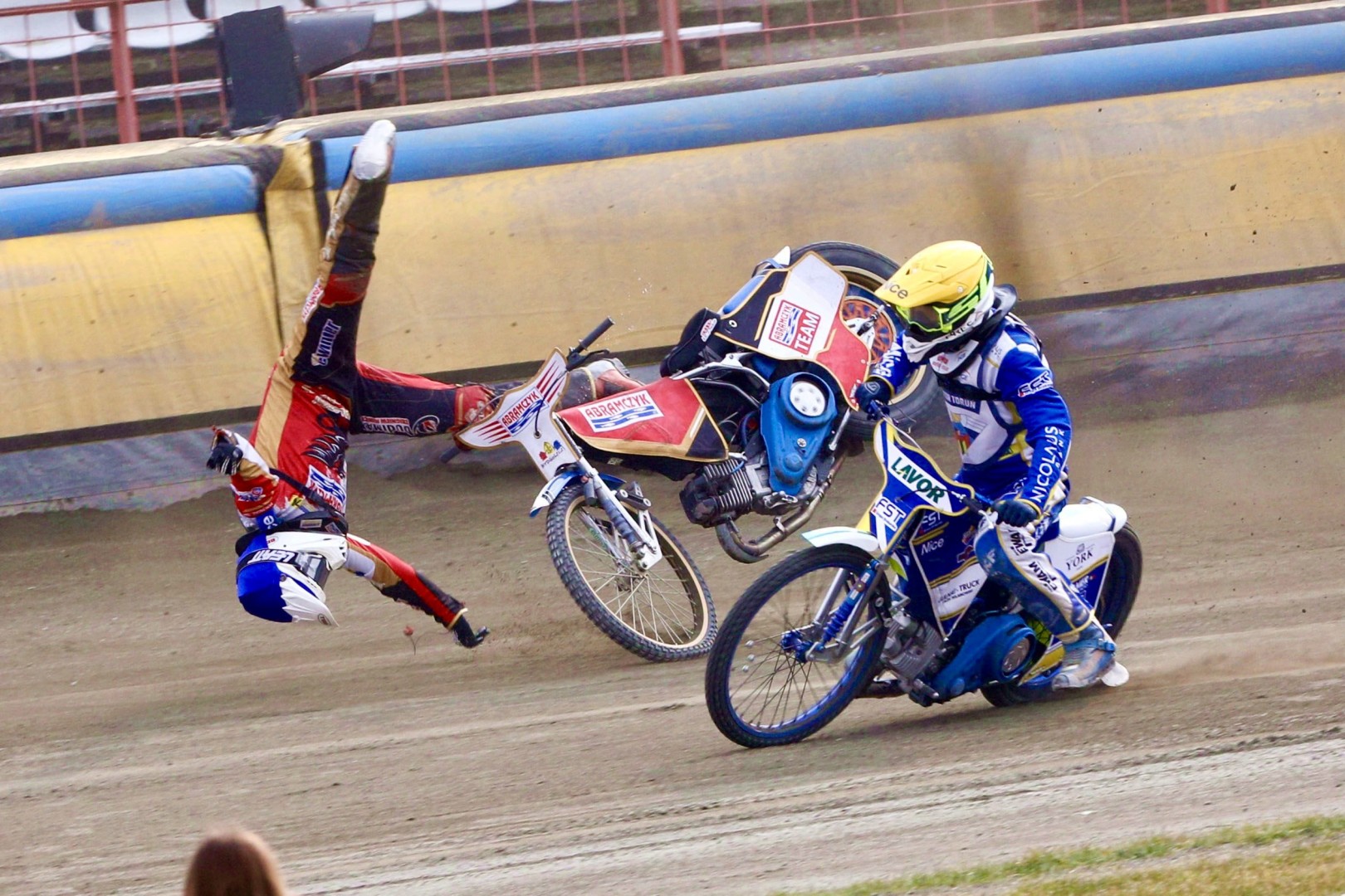Rally motor cyclist flying forwards off his bike in a starfish position.